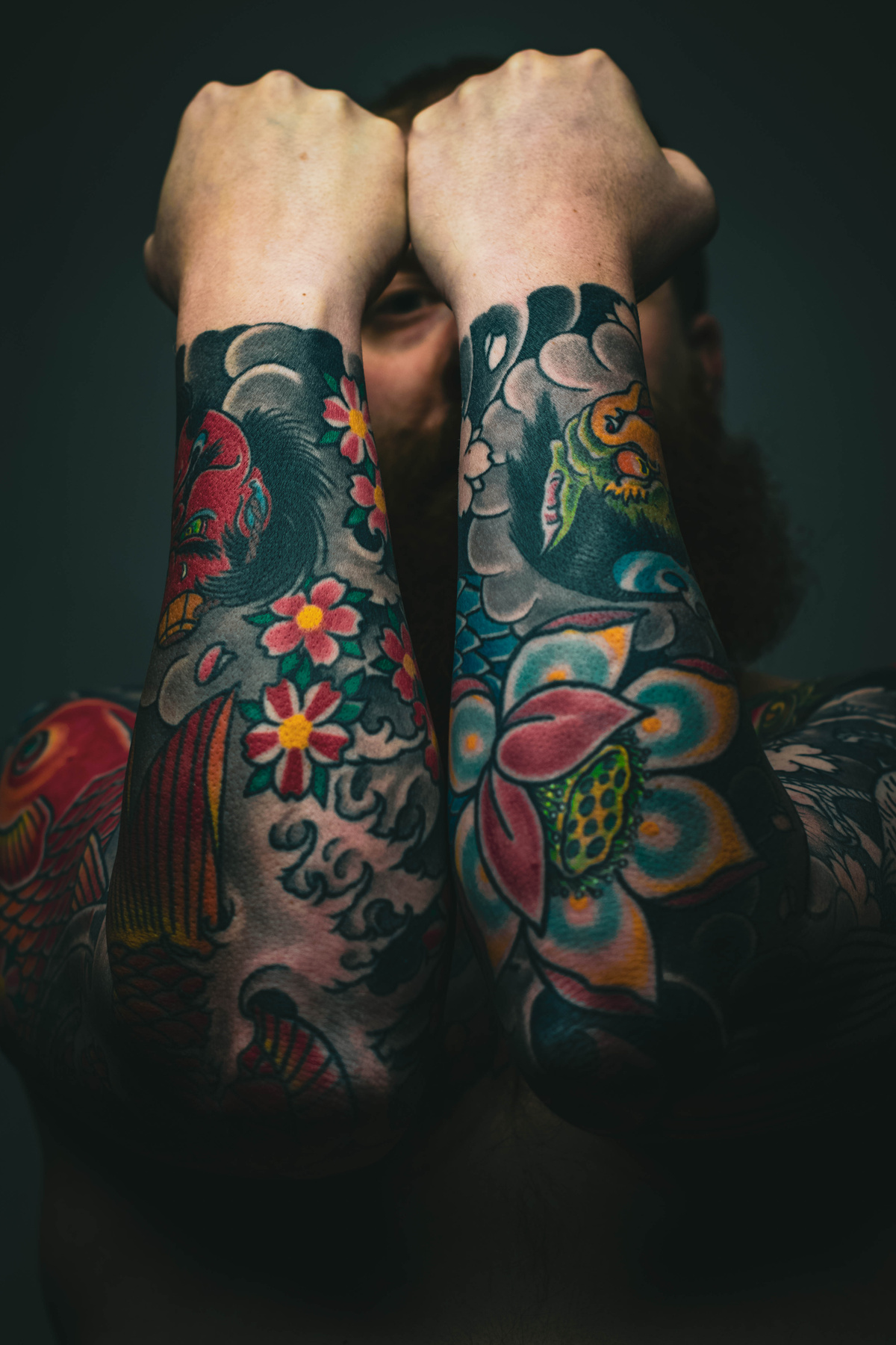 Man With Floral Arm Tattoos`